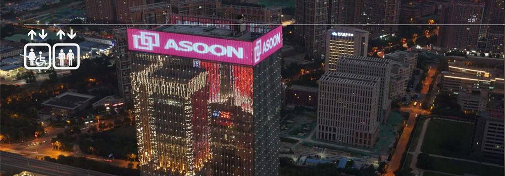 Asoon Elevator Advertisement on Building at Night